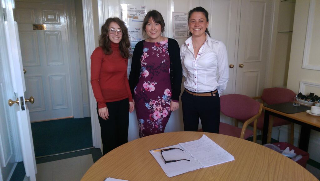 Natasha Howard BVRLA, Sophie Fielding and Beth Gillman standing in front of a table in a meeting room