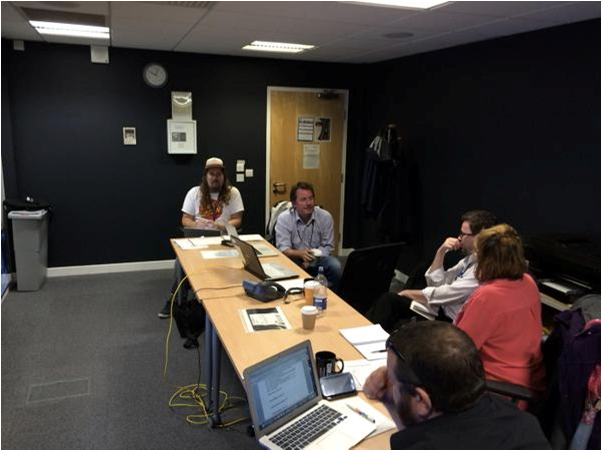 5 people sitting at desks using PCs to take part in user testing